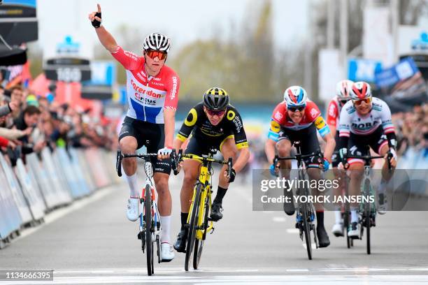 Netherland's Mathieu Van der Poel of Corendon-Circus celebrates as he crosses the finish line followed by France's Anthony Turgis of Direct Energie...