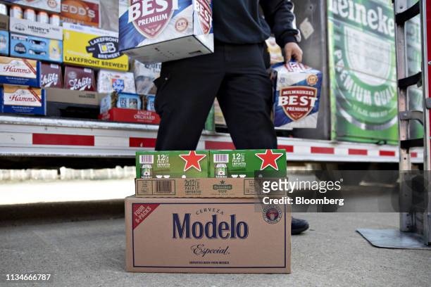 Case of Constellation Brands Inc. Modelo beer sits on the ground as a delivery is organized in Ottawa, Illinois, U.S., on Tuesday, April 2, 2019....