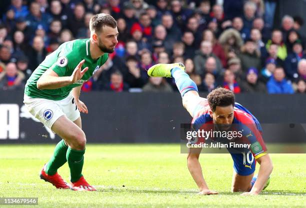 Andros Townsend of Crystal Palace is fouled by Davy Proepper of Brighton and Hove Albion and a penalty is awarded during the Premier League match...