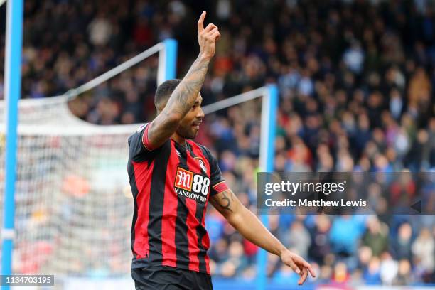 Callum Wilson of AFC Bournemouth celebrates after scoring his team's first goal during the Premier League match between Huddersfield Town and AFC...