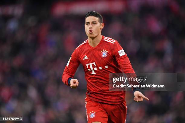 James Rodriguez of Bayern Munich celebrates after scoring his team's third goal during the Bundesliga match between FC Bayern Muenchen and VfL...