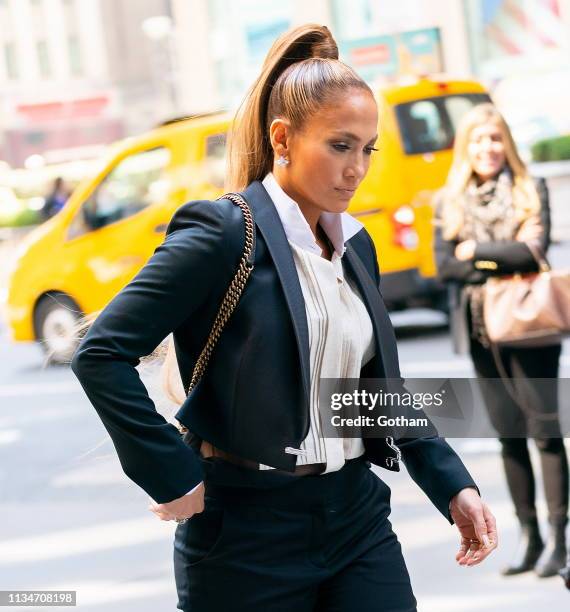 Jennifer Lopez arrives at Sirius radio wearing a high ponytail inspired by Ariana Grande on April 3, 2019 in New York City.