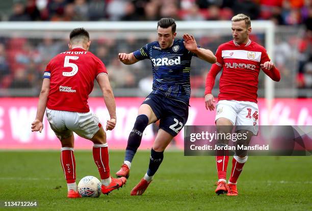 Jack Harrison of Leeds United tackles with Bailey Wright and Andreas Weinmann of Bristol City during the Sky Bet Championship between Bristol City...