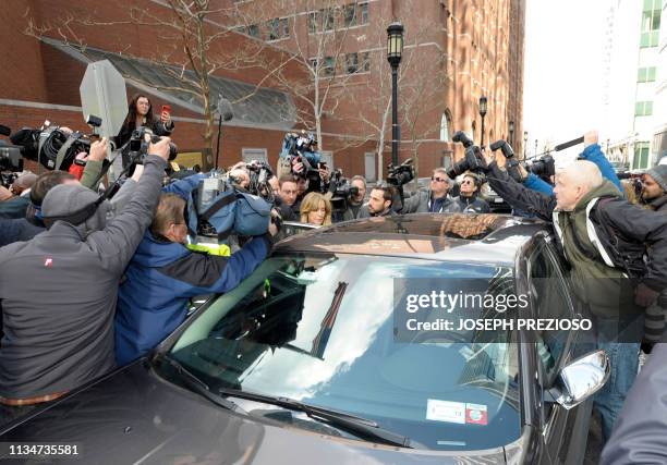 Actress Felicity Huffman exits the courthouse after facing charges for allegedly conspiring to commit mail fraud and other charges in the college...