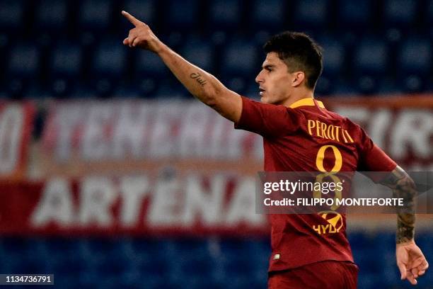 Roma Argentine forward Diego Perotti celebrates after scoring during the Italian Serie A football match AS Roma vs Fiorentina on April 3, 2019 at the...
