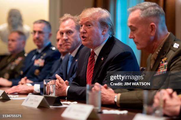 President Donald Trump is briefed by senior military leaders at the White House in Washington, DC, on April 3 including Chairman of the Joint Chiefs...