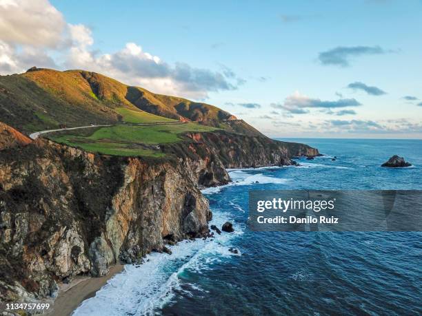 bixby creek bridge big sur aerial view highway one california coast beach sunset - big sur stock-fotos und bilder