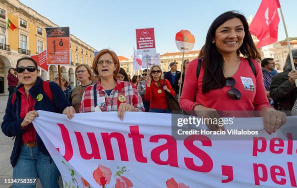 Addim Demonstrators hold signs in support of women's rights while parading ...