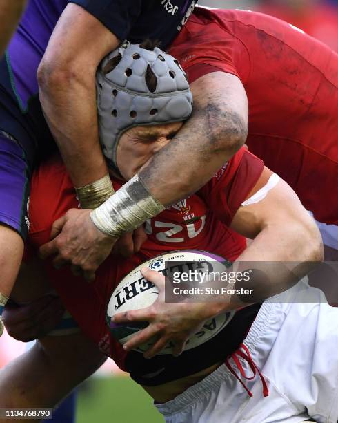 Wales player Jonathan Davies has his nose squashed in a tackle during the Guinness Six Nations match between Scotland and Wales at Murrayfield on...