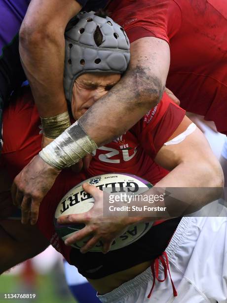 Wales player Jonathan Davies has his nose squashed in a tackle during the Guinness Six Nations match between Scotland and Wales at Murrayfield on...
