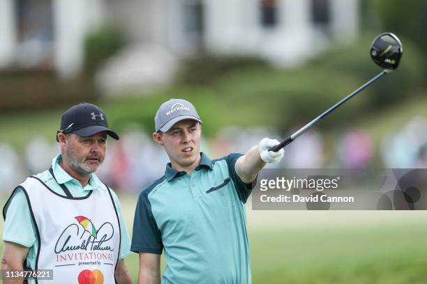 Matthew Fitzpatrick of England checks his line for his tee shot on the par 4, 18th hole with his caddie Billy Foster during the third round of the...