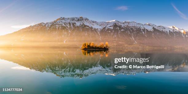 reflections at sunset on lake brienz, switzerland - bernese alps stock pictures, royalty-free photos & images