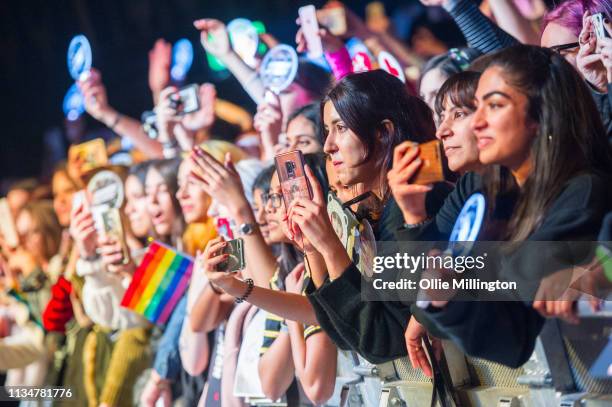 The crowd watch on as Ateez perform on stage at O2 Kentish Town Forum on April 3, 2019 in London, England.