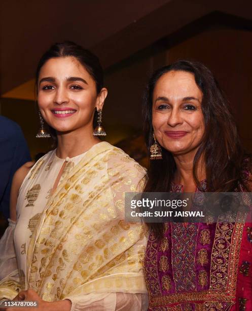 In this photo taken on April 3 Indian Bollywood actress Alia Bhatt aong with her mother Soni Razdan attend the screening of English-Urdu-Kashmiri...