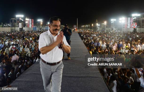 In this photo taken on March 24 Indian actor turned politician Kamal Haasan, founder of the Makkal Needhi Mayyam party, gestures to supporters at an...