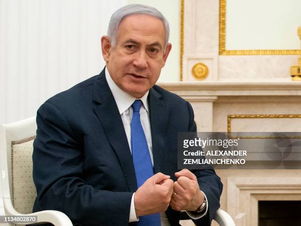 Israel's Prime Minister Benjamin Netanyahu gestures as he speaks with Russian President during their meeting at the Kremlin in Moscow on April 4,...
