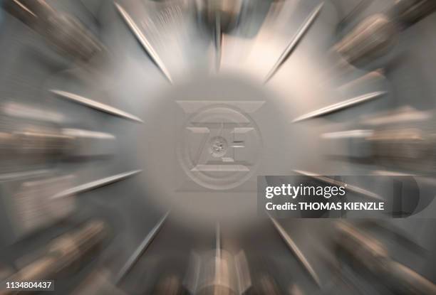 The logo of German auto parts maker ZF Friedrichshafen is printed on a truck wheel in an exhibition at the headquarters of German technology company...
