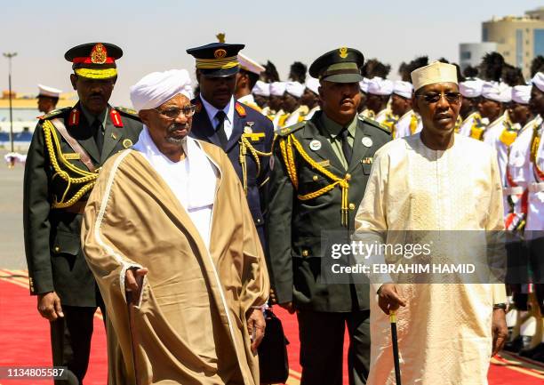 Sudanese President Omar al-Bashir receives his Chadian counterpart Idriss Deby at Khartoum International Airport outside the Sudanese capital on...