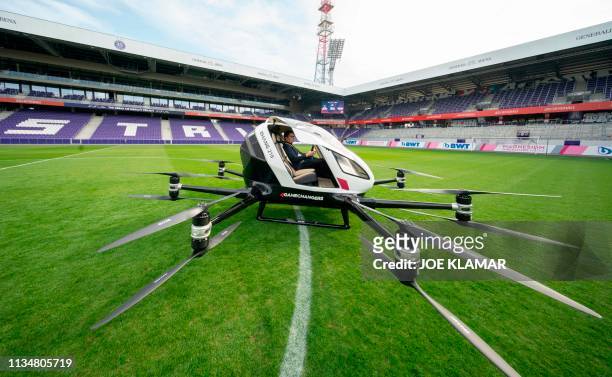 Norwegian journalist waits for a short flight in an Air Taxi EHANG 216 during a press preview of FACC AG on "Urban Air Mobility" at Generali Arena in...