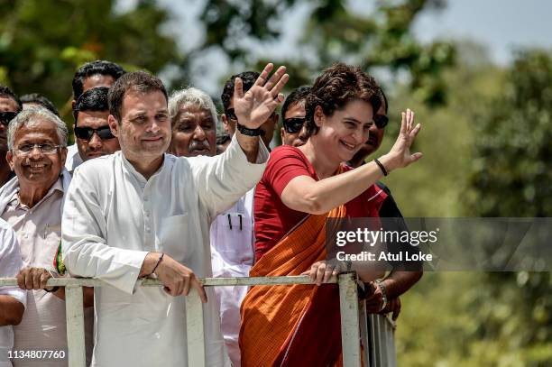 Rahul Gandhi and Priyanka Gandhi wave at the crowd in the road show after Rahul Gandhi filing nominations from Wayanad district on April 4, 2019 in...