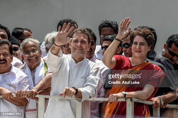 Rahul Gandhi and Priyanka Gandhi wave at the crowd in the road show after Rahul Gandhi filing nominations from Wayanad district on April 4, 2019 in...