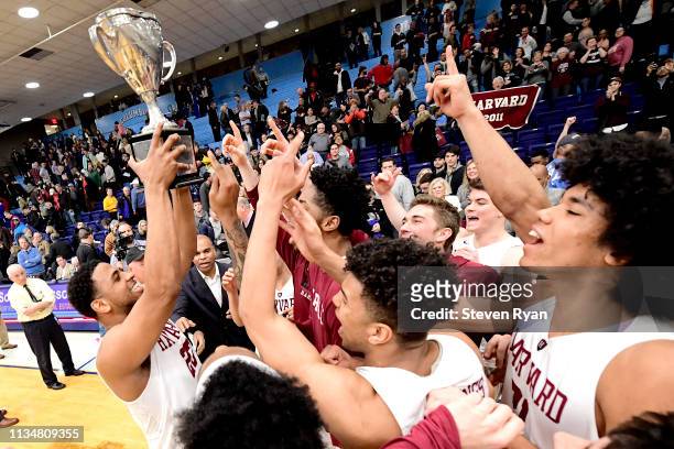 The Harvard Crimson celebrate their 83-81 win in overtime over the Columbia Lions to win the regular season IVY League title 1at Frances S. Levien...