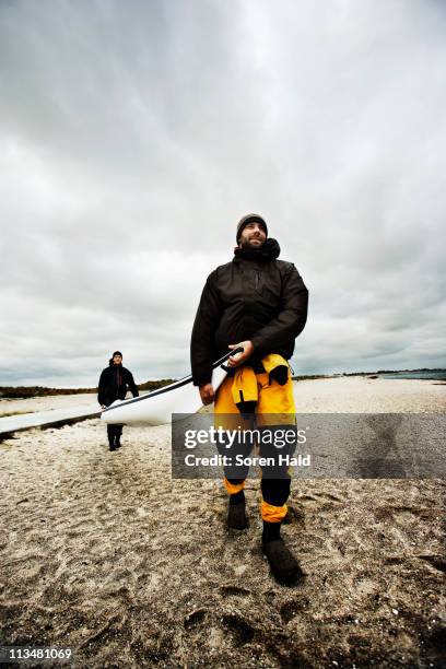 carrying kayak - rowboat stock pictures, royalty-free photos & images
