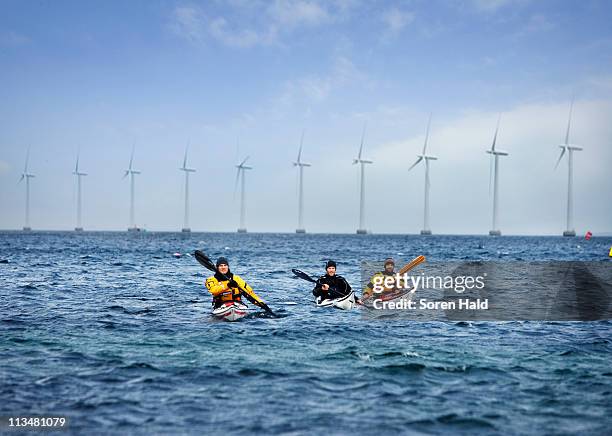 3 kayaks in front of mills - windmill denmark stock pictures, royalty-free photos & images