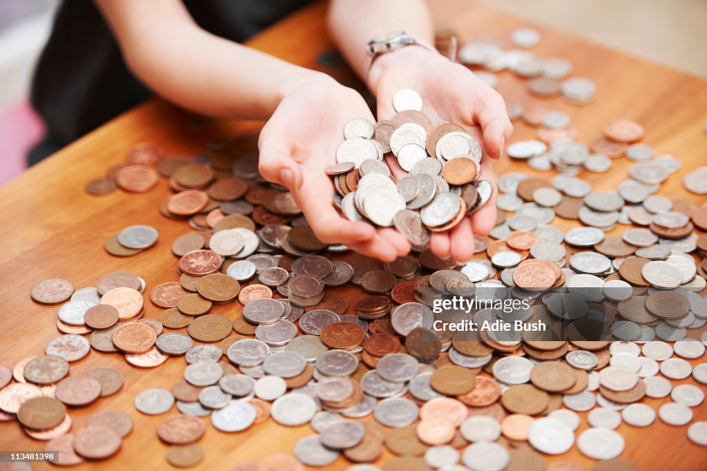 Girl holding coins in her hands