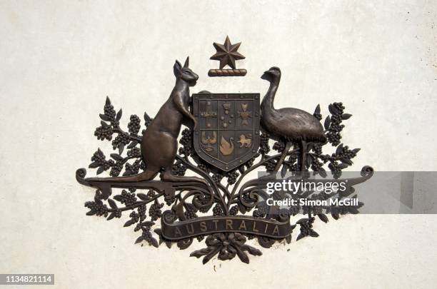 australian coat of arms on the australian peacekeeping memorial, anzac parade, canberra, australian capital territory, australia - australian coat of arms stock pictures, royalty-free photos & images