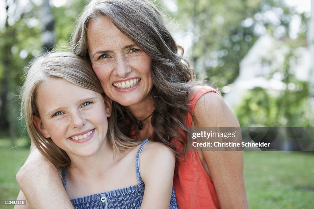 Mother and daugther in garden