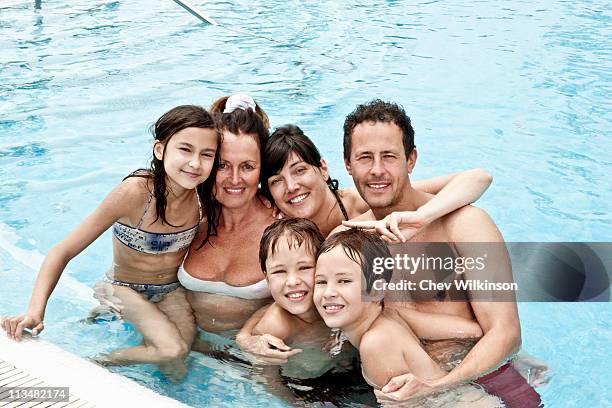 family portrait in pool - older woman wet hair stock pictures, royalty-free photos & images