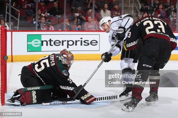 Dustin Brown of the Los Angeles Kings hits the post with a shot behind goaltender Darcy Kuemper of the Arizona Coyotes during the third period of the...