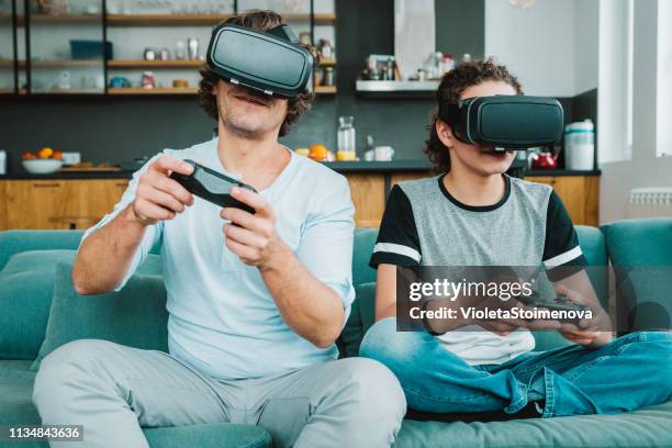 father and son playing with vr - watching parents fight stock pictures, royalty-free photos & images