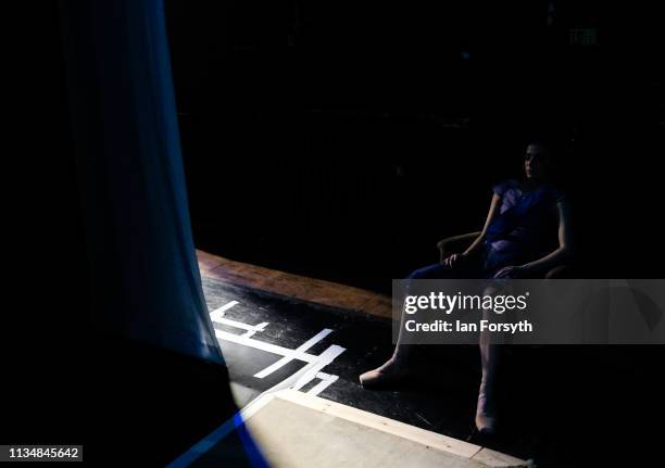 Dancer sits in a chair and rests as she exits the stage during the World Premier of Northern Ballet’s performance of ‘Victoria’ at Leeds Grand...