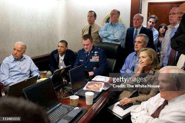 In this handout image provided by The White House, President Barack Obama, Vice President Joe Biden, Secretary of State Hillary Clinton and members...