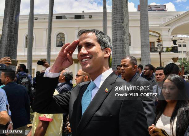 Juan Guaido , the speaker of the Venezuelan opposition-controlled National Assembly who declared himself interim president in January, leaves after...