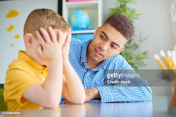 barriers to learning - teacher crying stock pictures, royalty-free photos & images