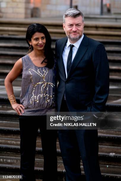 British writer Charlie Brooker and his wife, presenter Connie Huq pose on arrival for the Global Premiere of "Our Planet" in London on April 4, 2019.