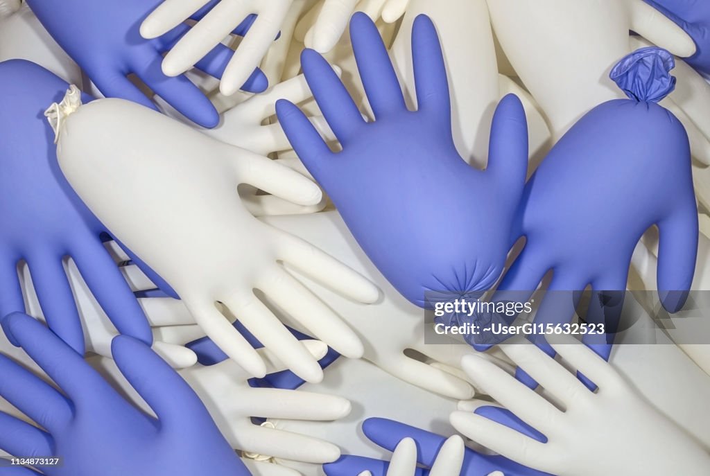 White and blue inflated medical latex gloves background