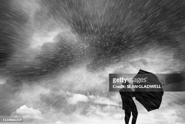 silhouette of man in blizzard - man snow wind stock pictures, royalty-free photos & images