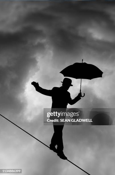 storm balancing act - risk control stock pictures, royalty-free photos & images