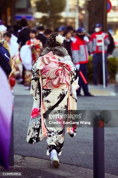 japanese new adults wearing kimonos on 'coming of age day' on the street in yokohama - japan coming of age day 2019 stock pictures, royalty-free photos & images