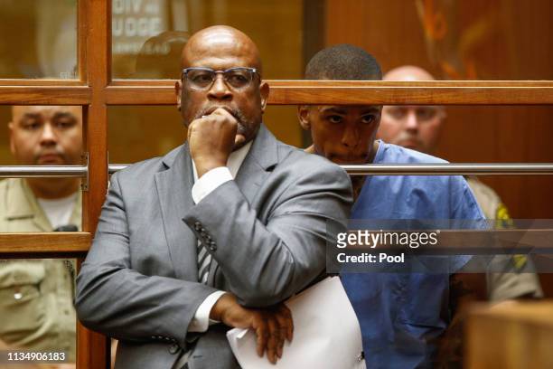 Eric Ronald Holder Jr. Who is accused of killing of rapper Nipsey Hussle, appears for arraignment with his Attorney Christopher Darden on April 4,...