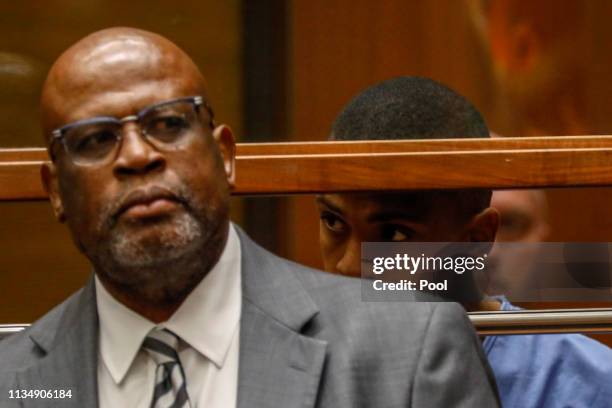 Eric Ronald Holder Jr. Who is accused of killing of rapper Nipsey Hussle, appears for arraignment with his Attorney Christopher Darden on April 4,...