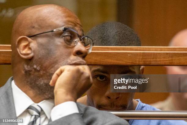Eric Ronald Holder Jr. Who is accused of killing of rapper Nipsey Hussle, appears for arraignment with his Attorney Christopher Darden on April 4,...