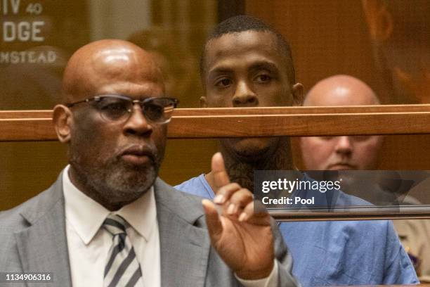 Eric Ronald Holder Jr. Who is accused of killing of rapper Nipsey Hussle, appears for arraignment with his Attorney Christopher Darden on April 4,...