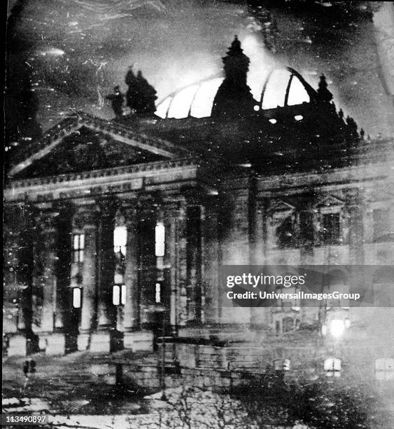 The Reichstag building on fire after an arson attack, Berlin, 27th February 1933. The event, which Adolf Hitler blamed on the Comintern at the time,...