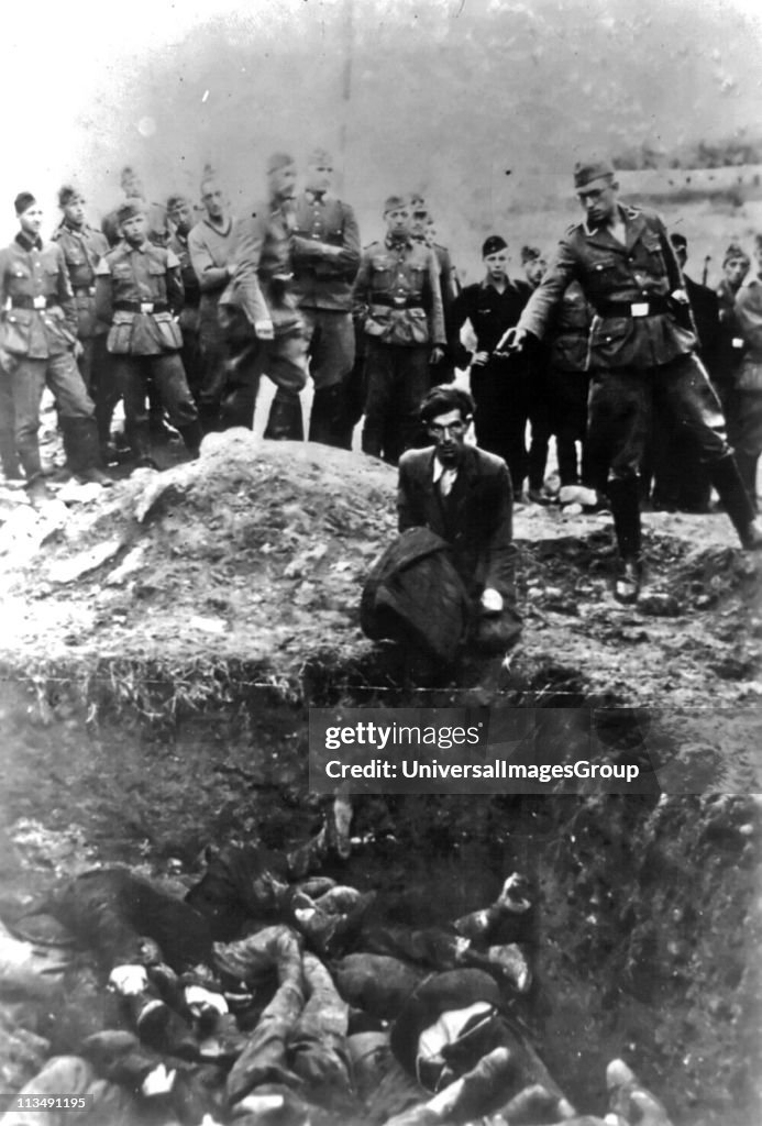 The Final Solution to the Jewish Question: An Einsatzgruppe D soldier about to shoot a Jew kneeling at a partially filled mass grave in Vinnitsa, Ukrainian SSR, Soviet Union, in 1942. The Einsatzgruppen were SS paramilitary task forces whose main purpose ...