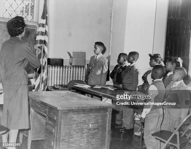 Mrs Claire Cumberbatch, of 1303 Dean Street, leader of the Bedford-Stuyvesant group protesting alleged segregated school, leads the oath of...